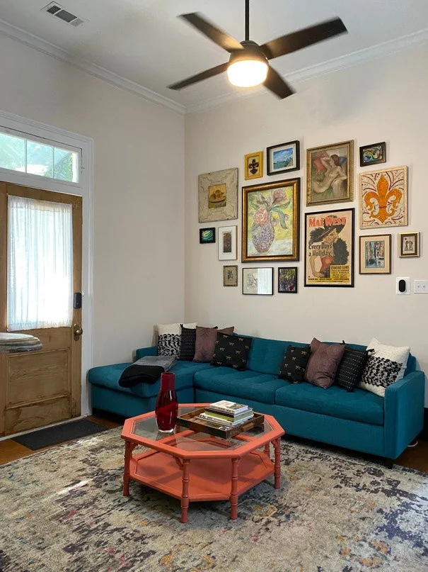 Artsy Cozy Home living room with a teal sofa